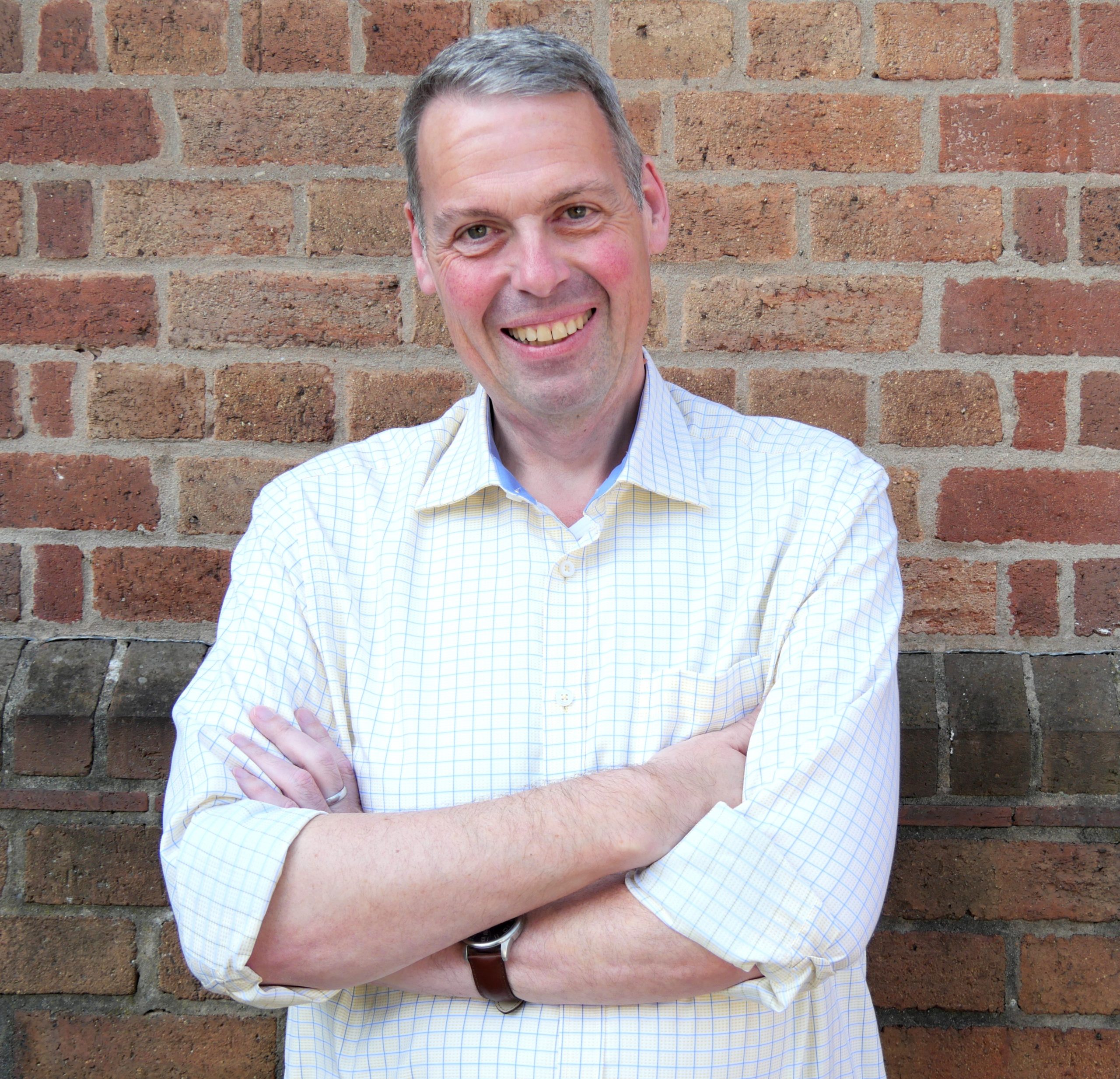 Dr David Langley smiling at the camera